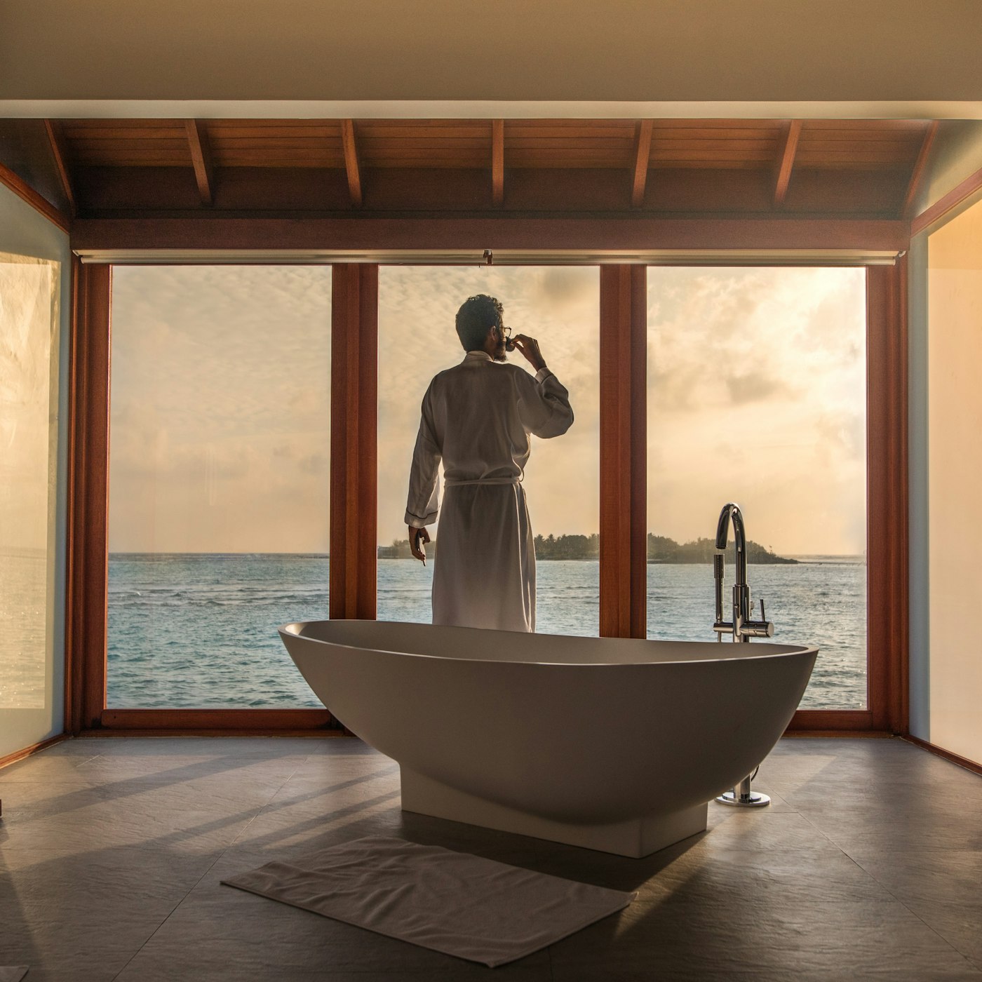 Overwater villa suite at sunrise