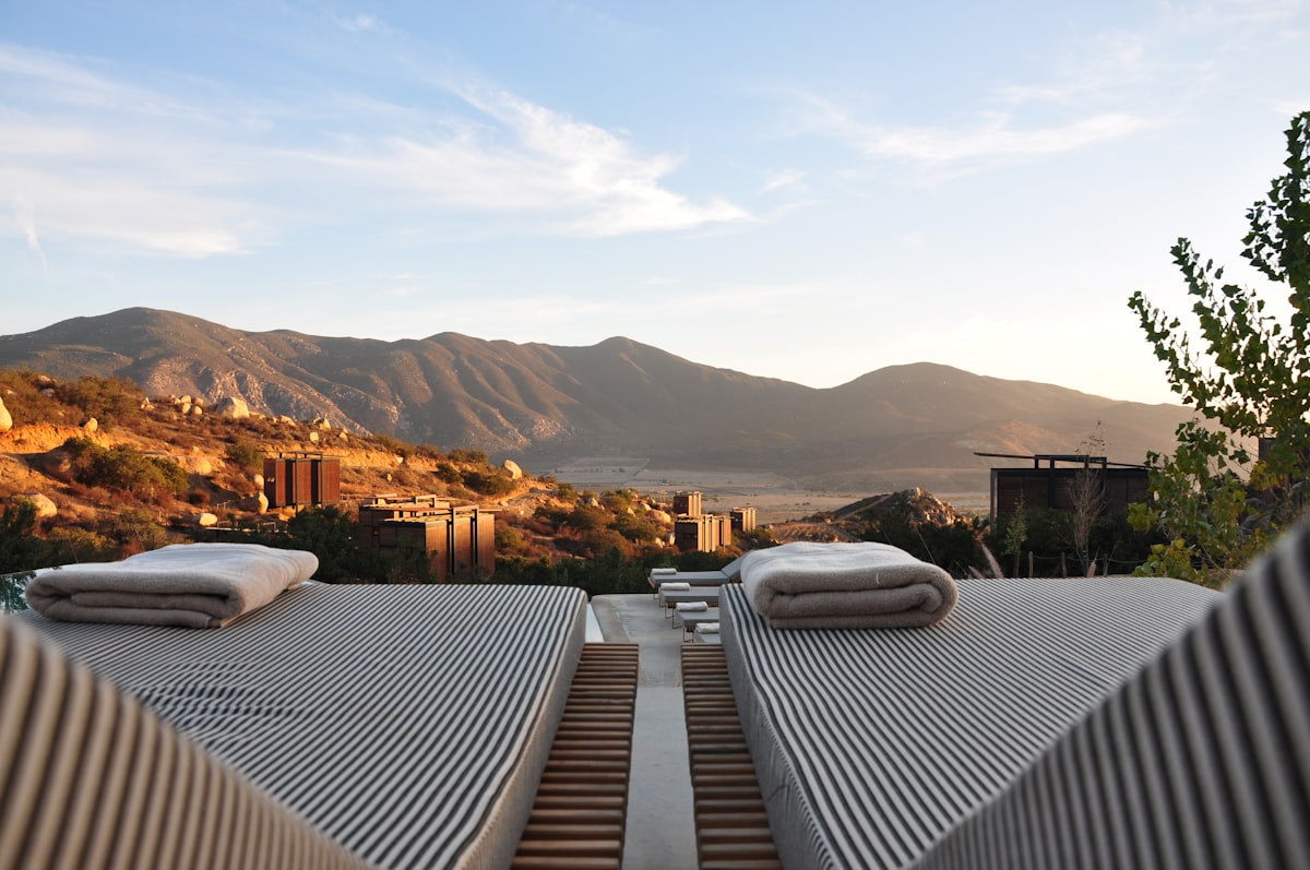 Resort sun loungers overlooking hills