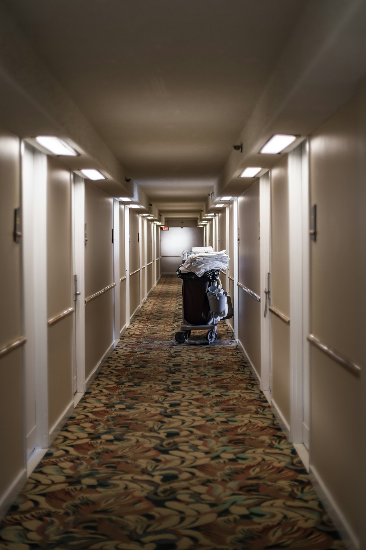 Hotel corridor with housekeeping cart